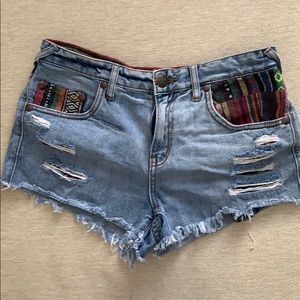 Free people blue jean shorts with colored trim